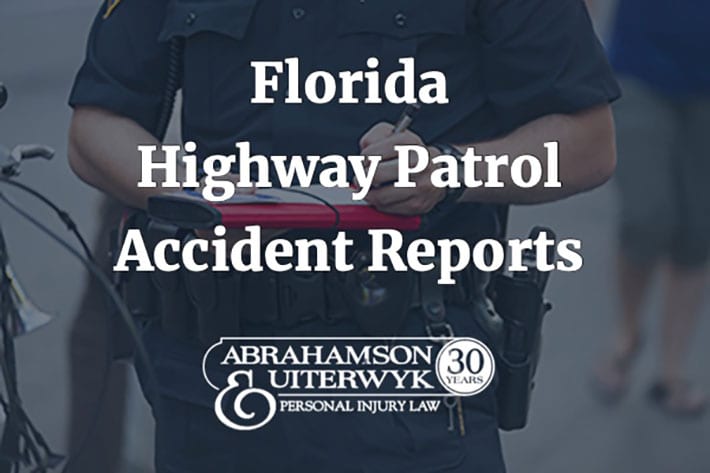 photo of a Florida Highway Patrol accident report being completed